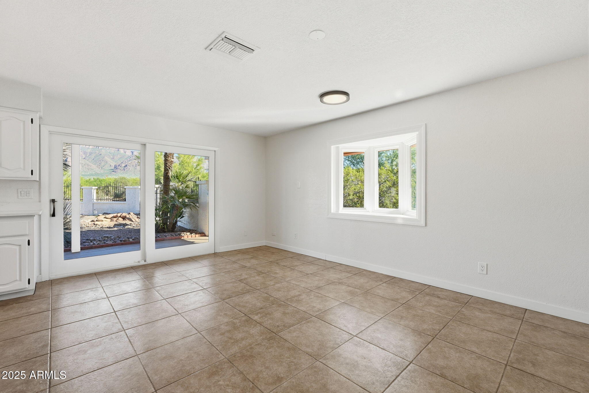 5810 East 14th Avenue Apache Junction, AZ 85119 - Photo 20 of 38 a view of an empty room with a window