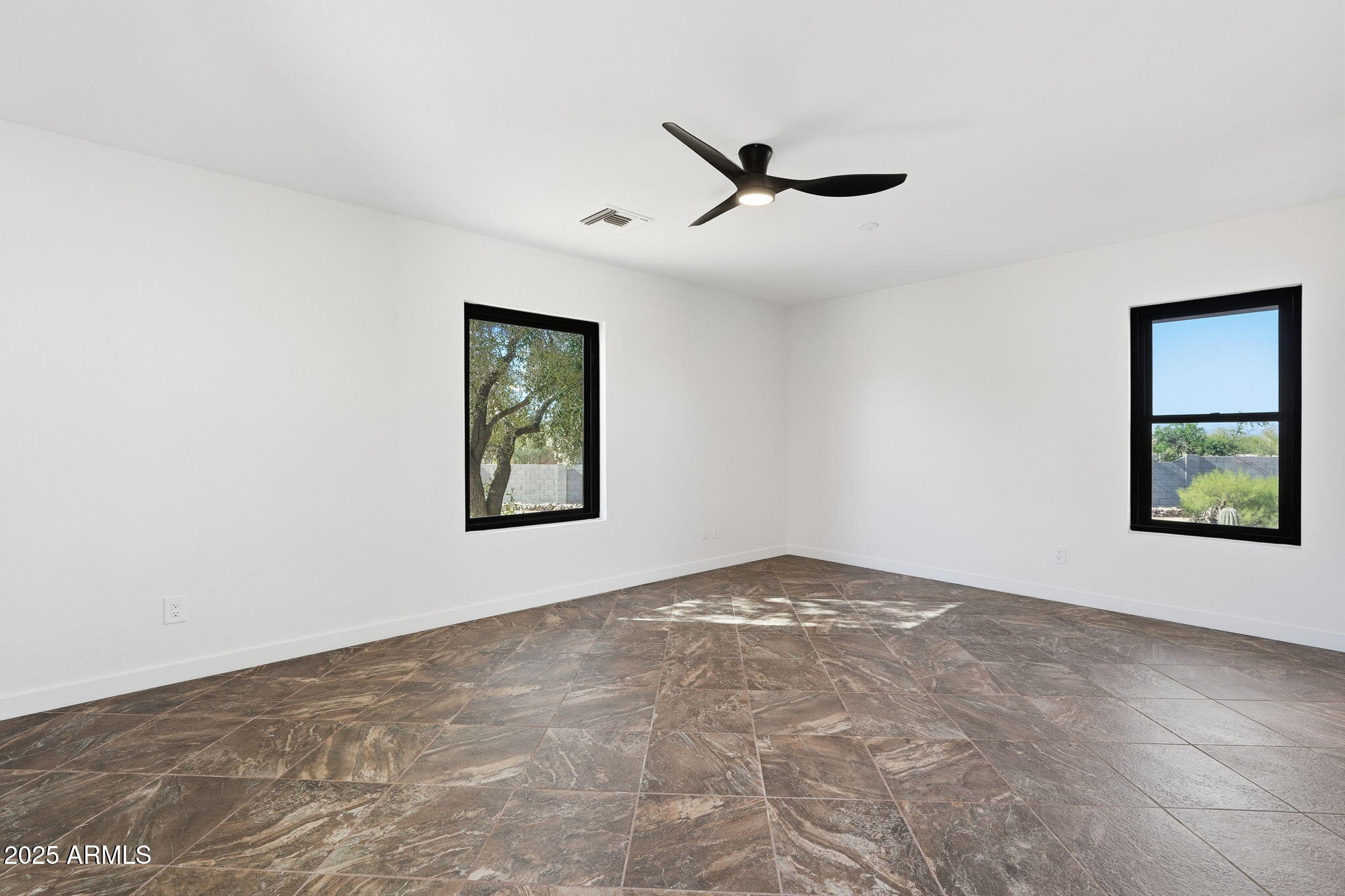 5810 East 14th Avenue Apache Junction, AZ 85119 - Photo 25 of 38 a view of an empty room with a window