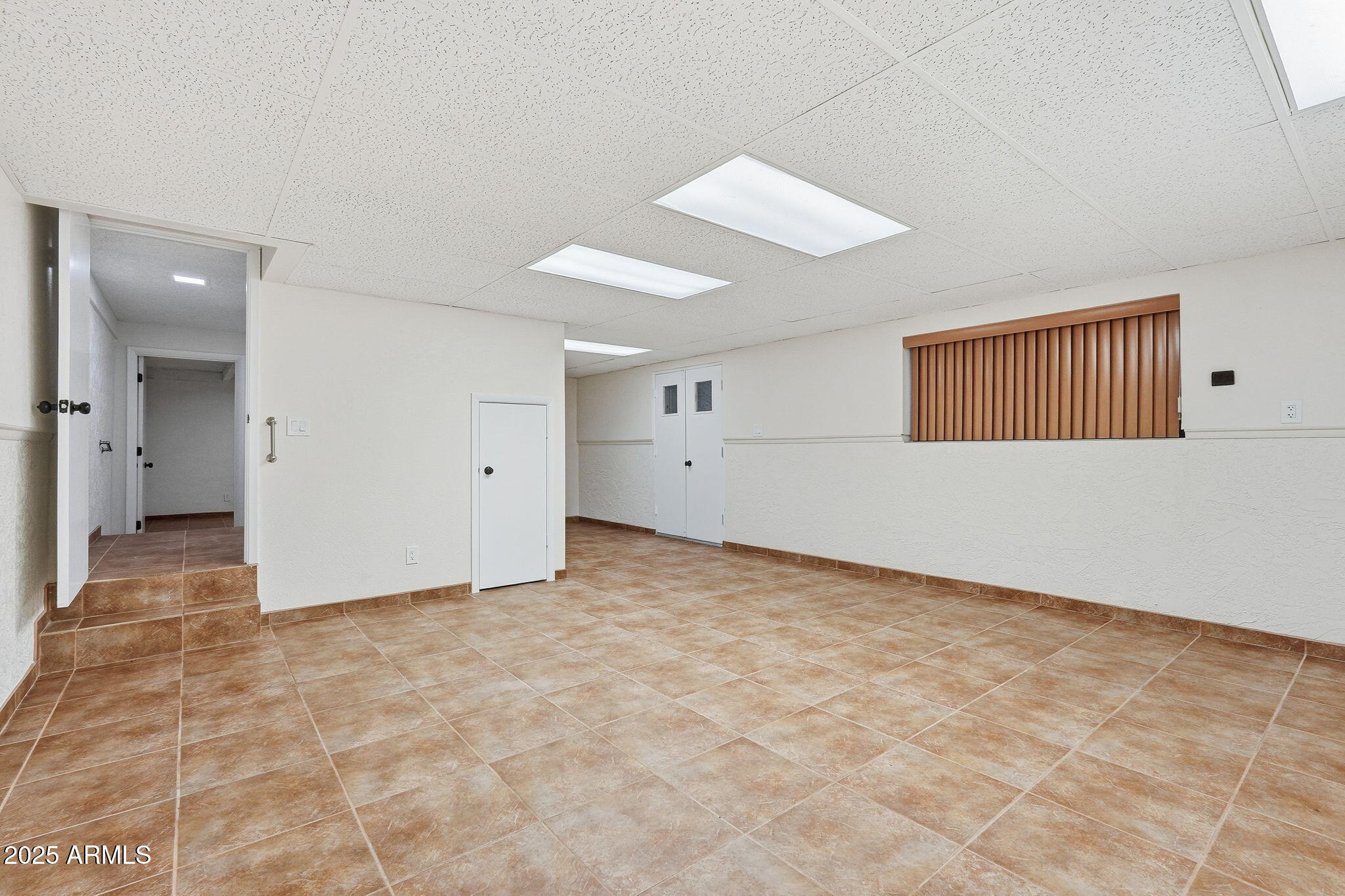 5810 East 14th Avenue Apache Junction, AZ 85119 - Photo 30 of 38 an empty room with an entryway and fan