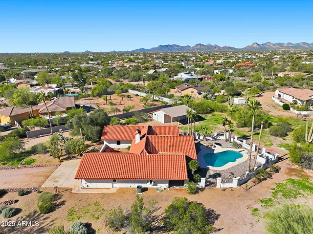 an aerial view of a houses with a outdoor space