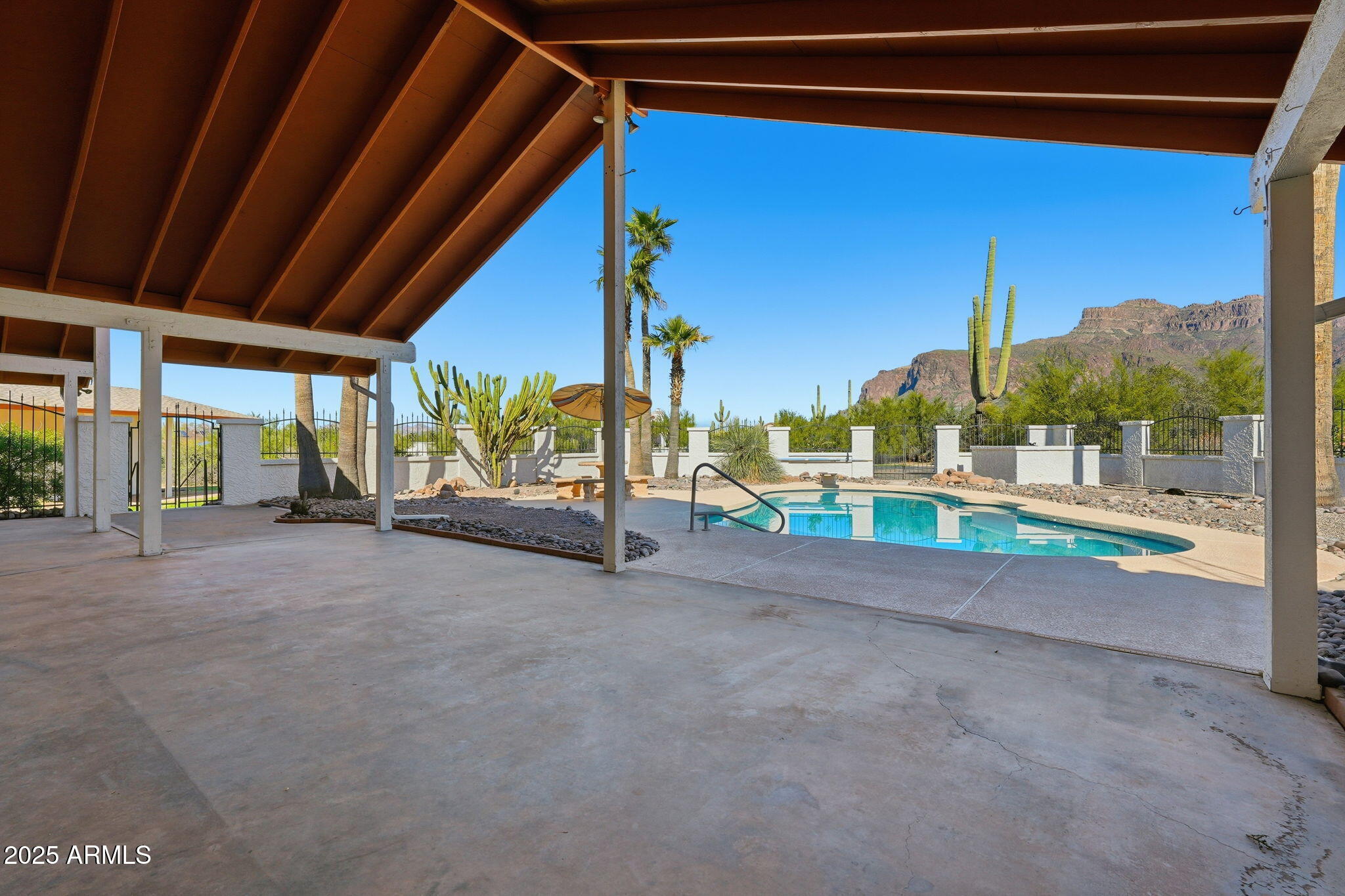 5810 East 14th Avenue Apache Junction, AZ 85119 - Photo 34 of 38 a view of a house with porch and a garage