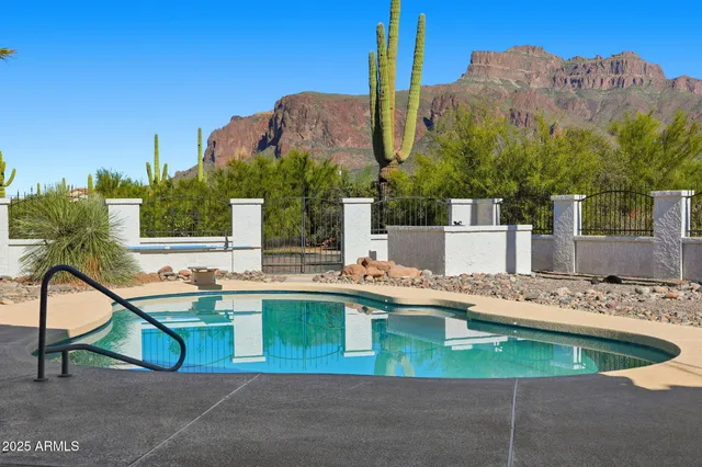 a view of a chairs and table in the patio