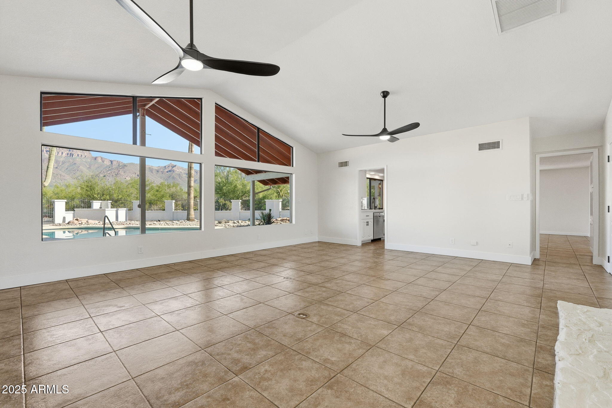 5810 East 14th Avenue Apache Junction, AZ 85119 - Photo 9 of 38 a view of an empty room with a window