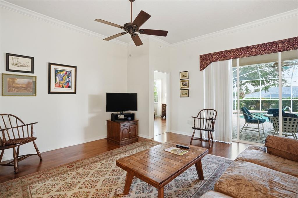 14228 Presteign Lane Spring Hill, FL 34609 - Photo 21 of 89 a living room with furniture and a flat screen tv