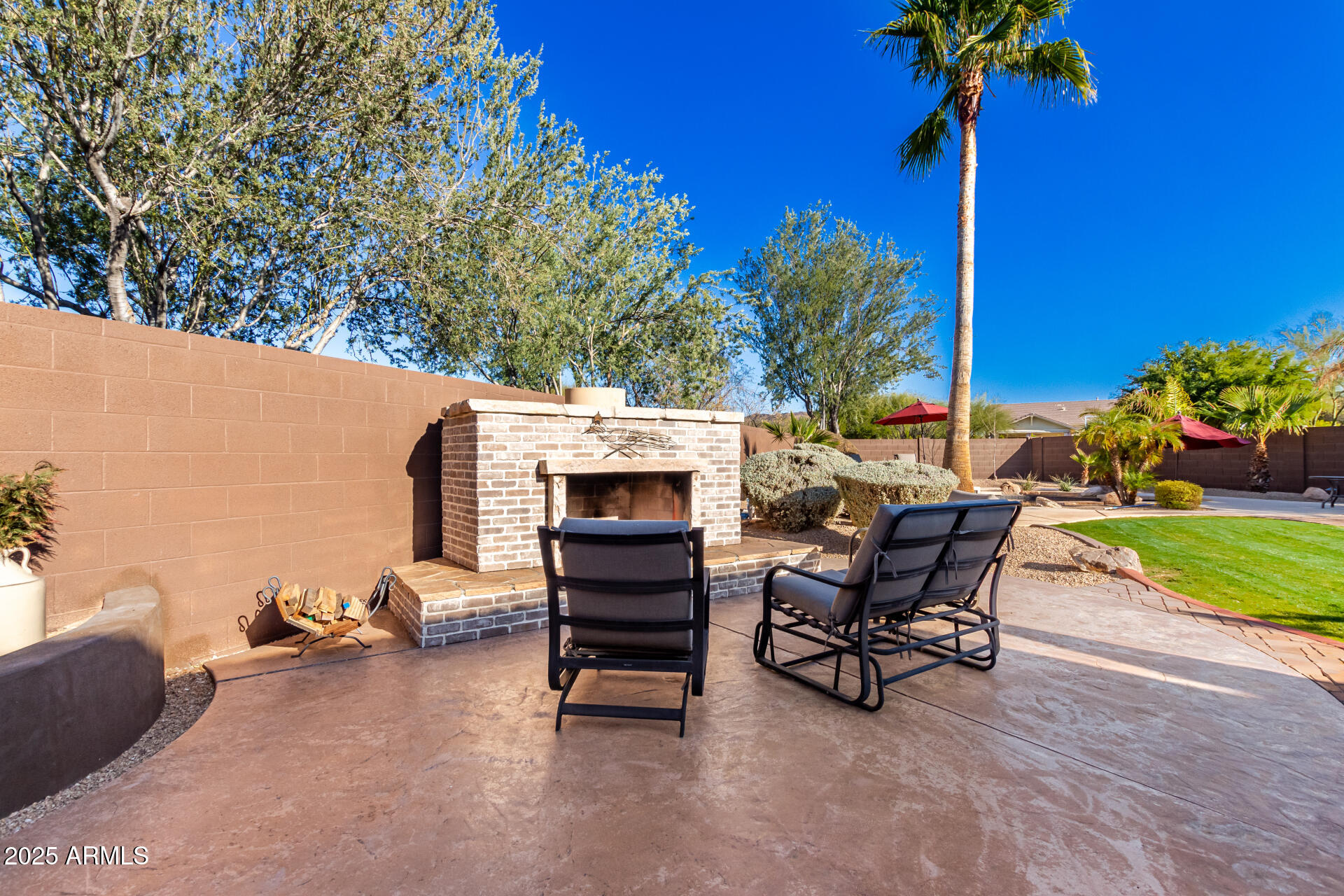 5902 West Gambit Trail Phoenix, AZ 85083 - Photo 11 of 62 a view of a patio with a table and chairs