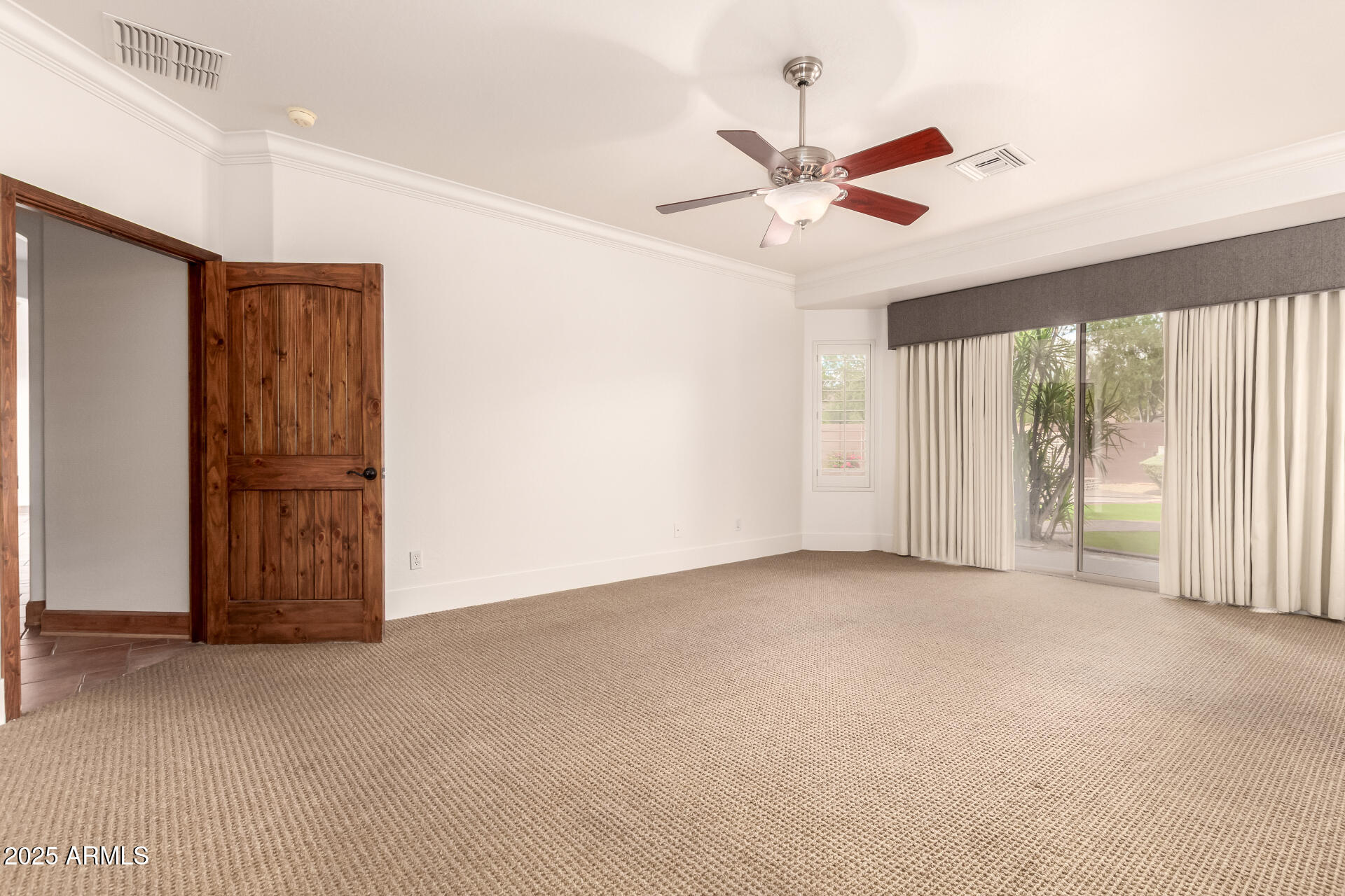 5902 West Gambit Trail Phoenix, AZ 85083 - Photo 14 of 62 a view of an empty room with a window