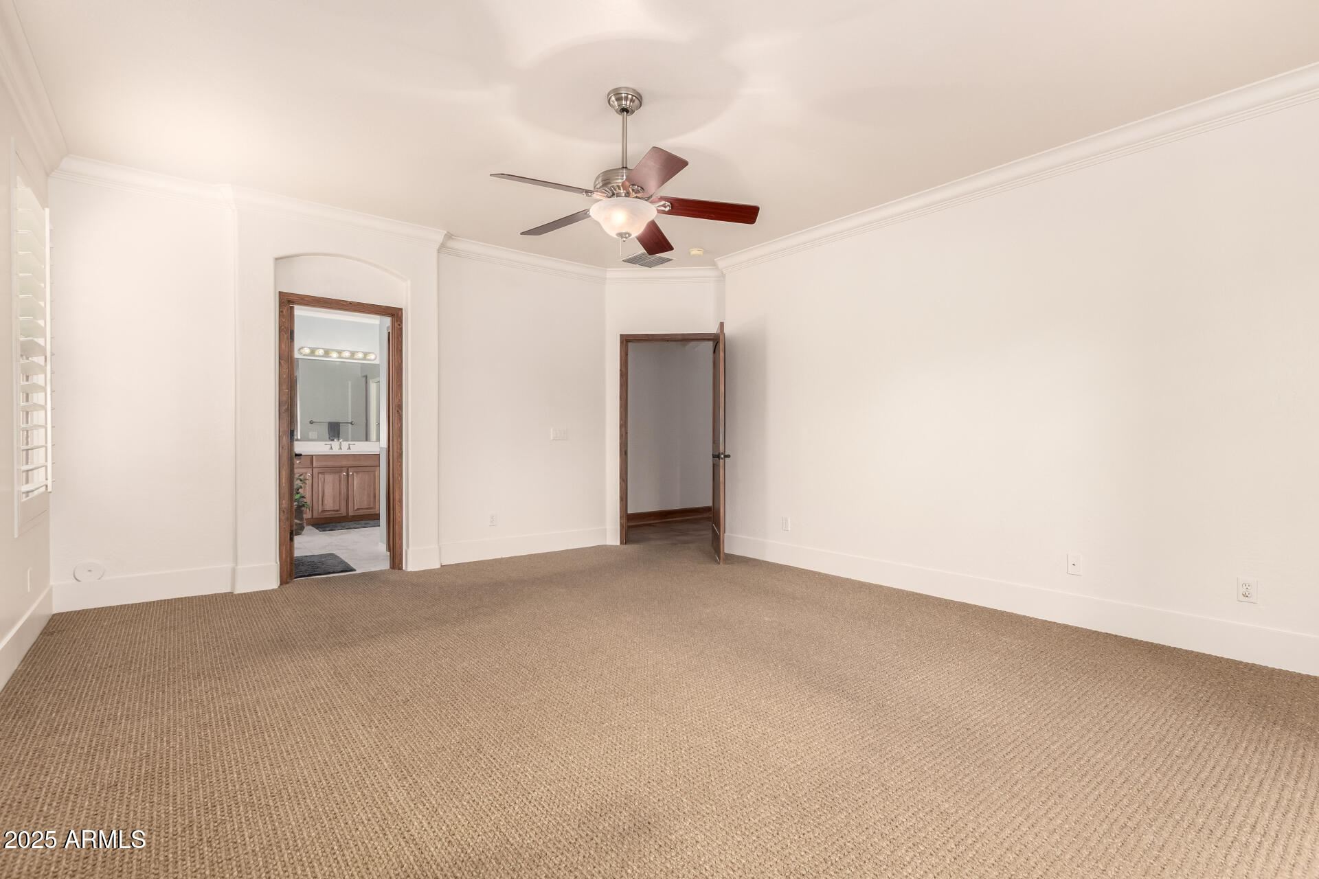 5902 West Gambit Trail Phoenix, AZ 85083 - Photo 16 of 62 an empty room with a ceiling fan and a window