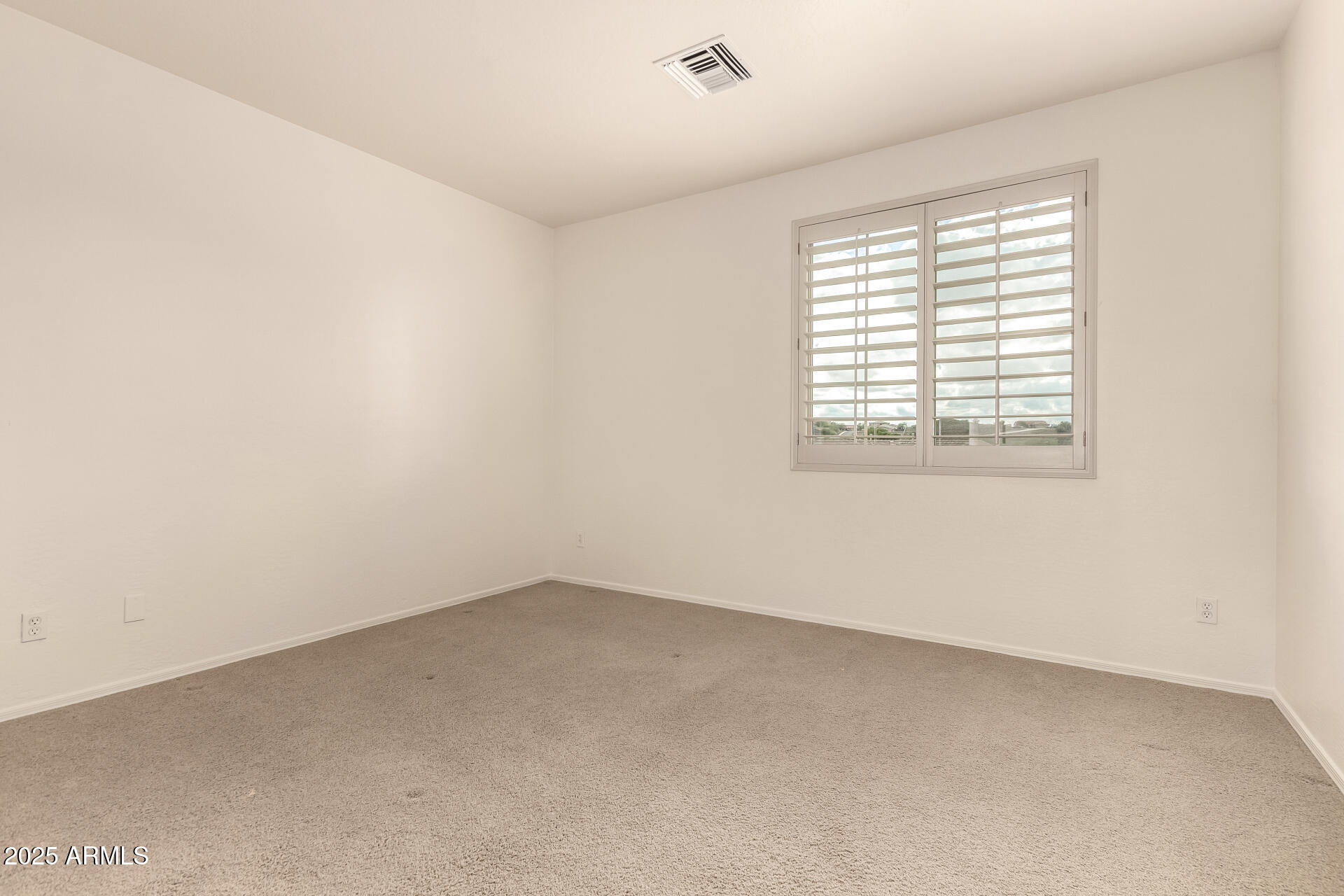 5902 West Gambit Trail Phoenix, AZ 85083 - Photo 24 of 62 an empty room with a window