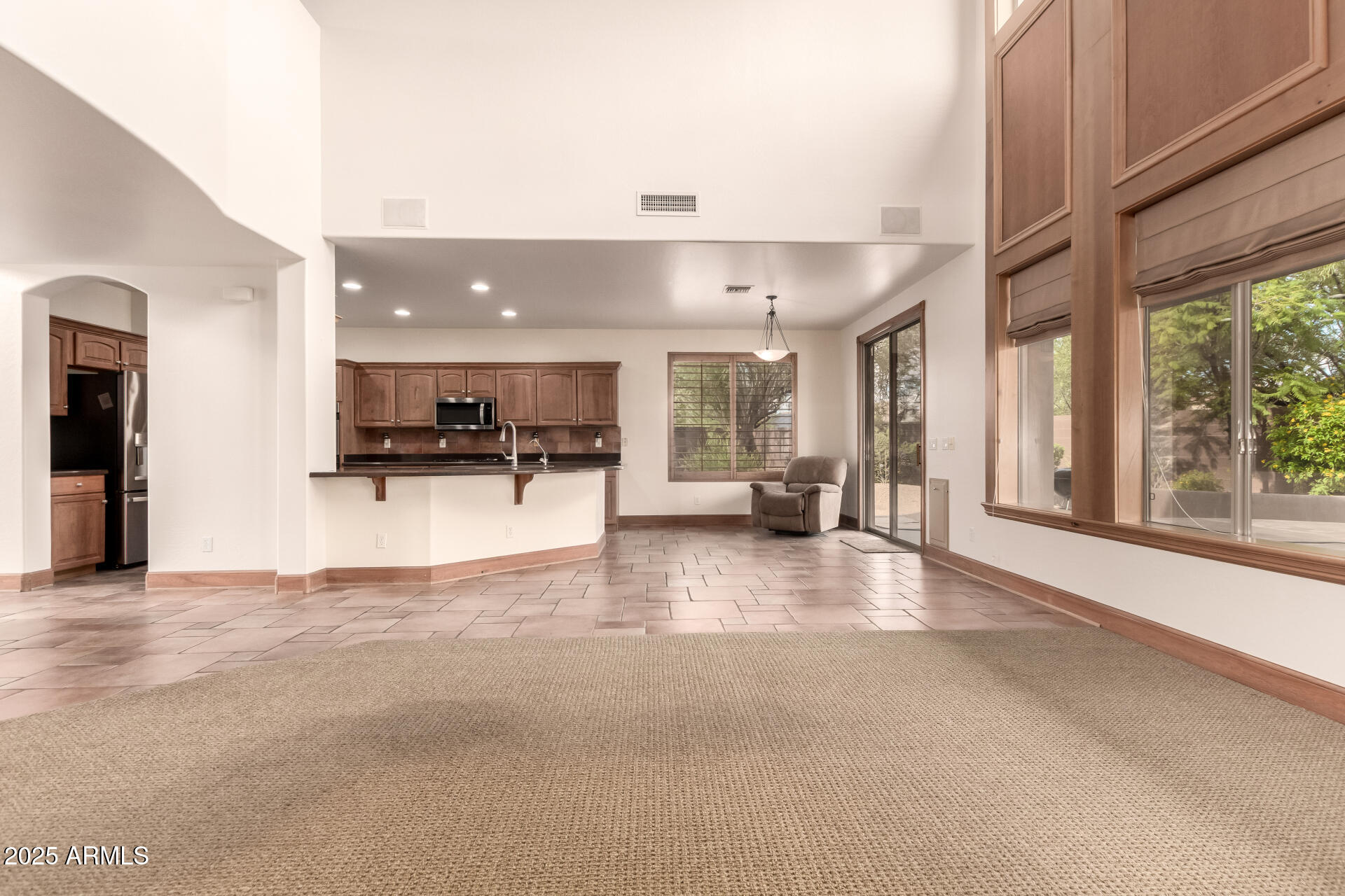 5902 West Gambit Trail Phoenix, AZ 85083 - Photo 44 of 62 a view of a kitchen with a sink and a large window