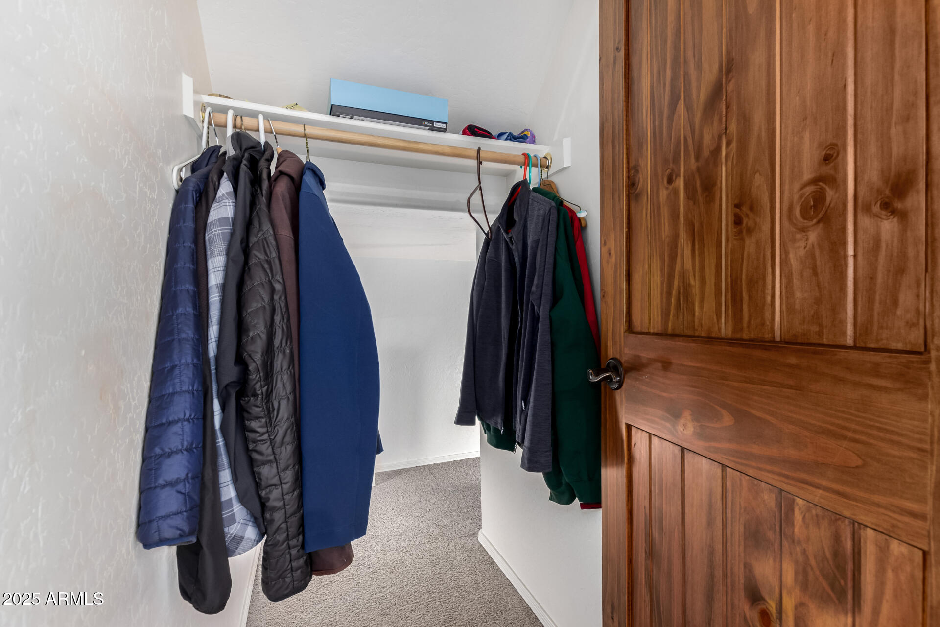 5902 West Gambit Trail Phoenix, AZ 85083 - Photo 59 of 62 a view of walk in closet with clothes and shoes