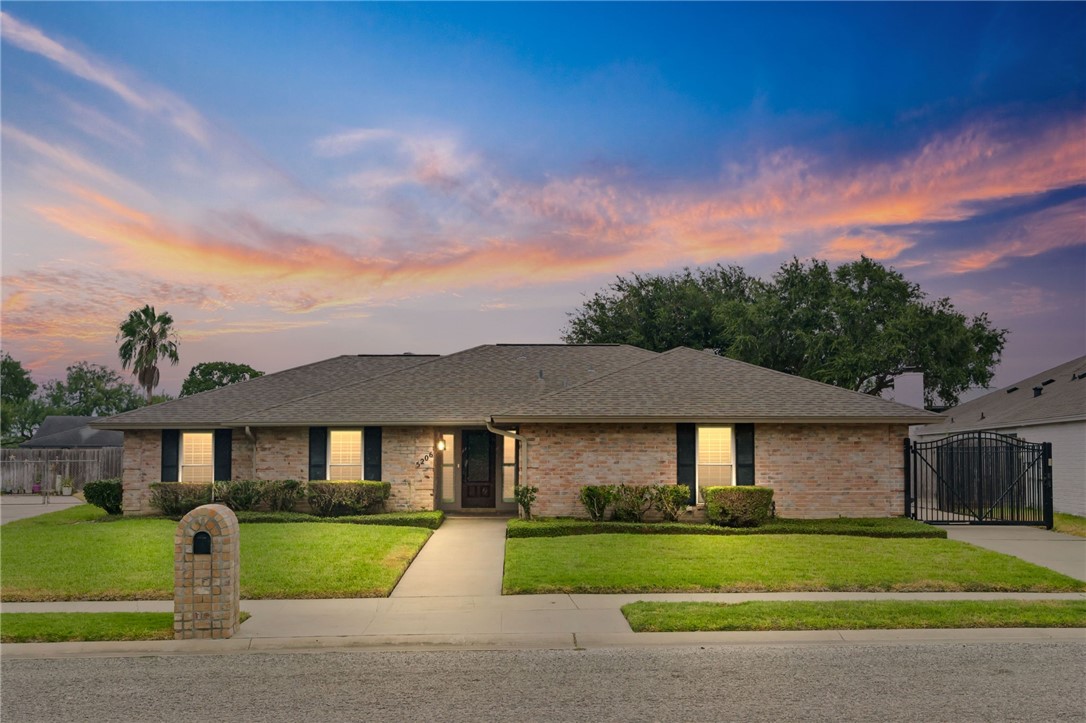5206 Moultrie Drive Corpus Christi, TX 78413 - Photo 1 of 1 a front view of a house with a yard and garage