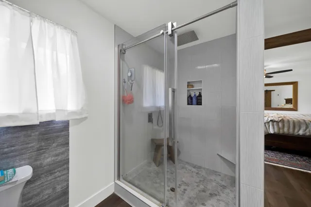 a view of walk in closet with clothes