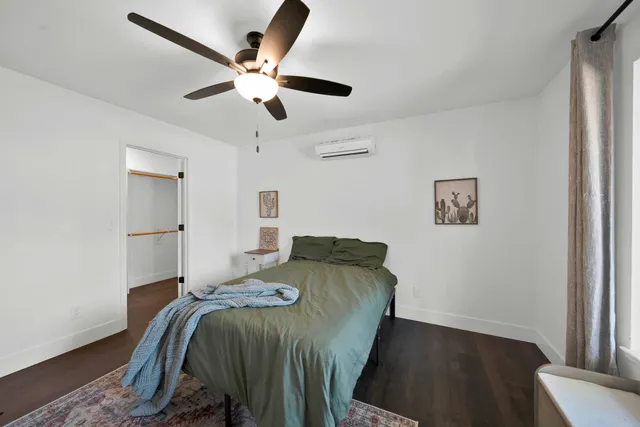 a bed room with a bed and a window