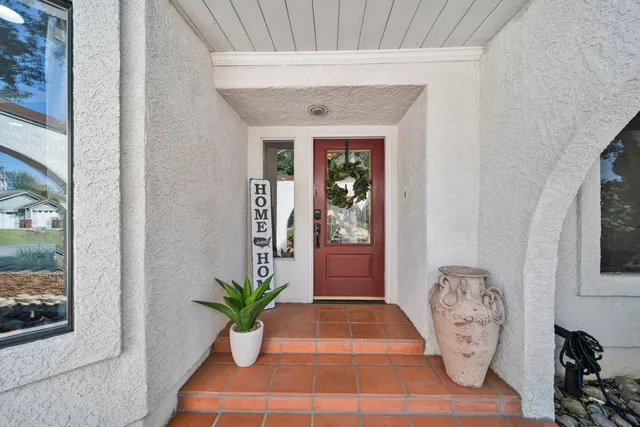 a view of living room with furniture and wooden floor