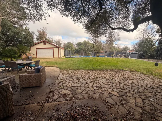 a view of backyard with green space