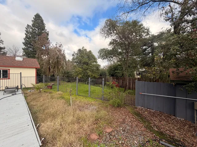 a backyard of a house with lots of green space