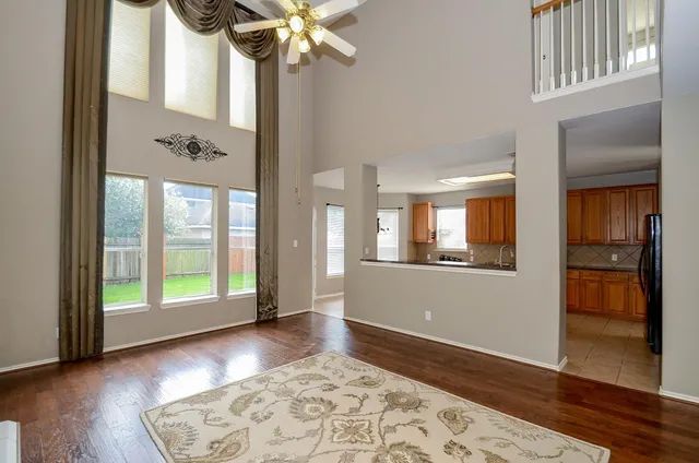 a view of an entryway with wooden floor and a chandelier