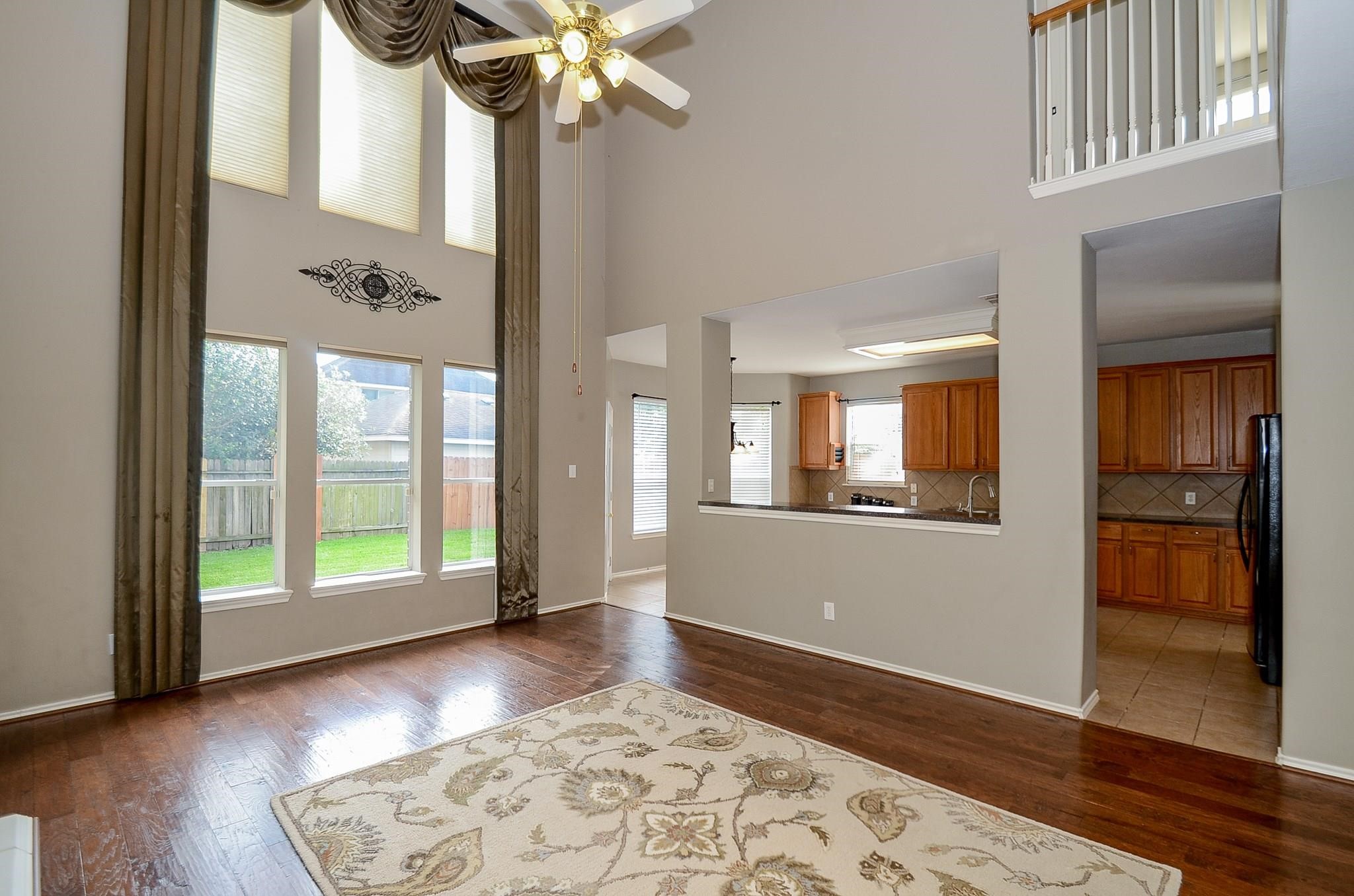a view of an entryway with wooden floor and a chandelier
