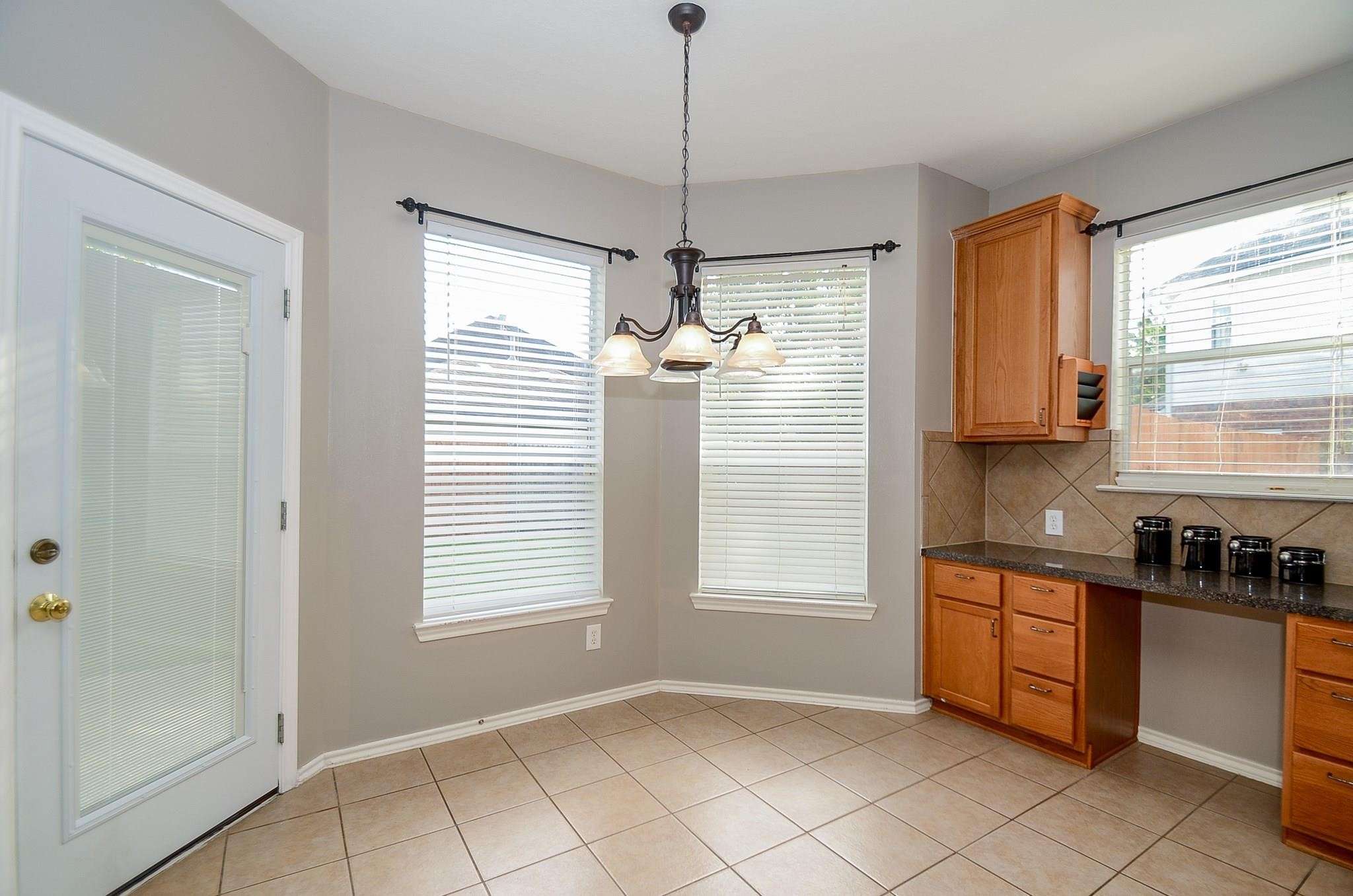 23719 Tustin Ranch Court Katy, TX 77494 - Photo 13 of 31 a kitchen that has a window in it