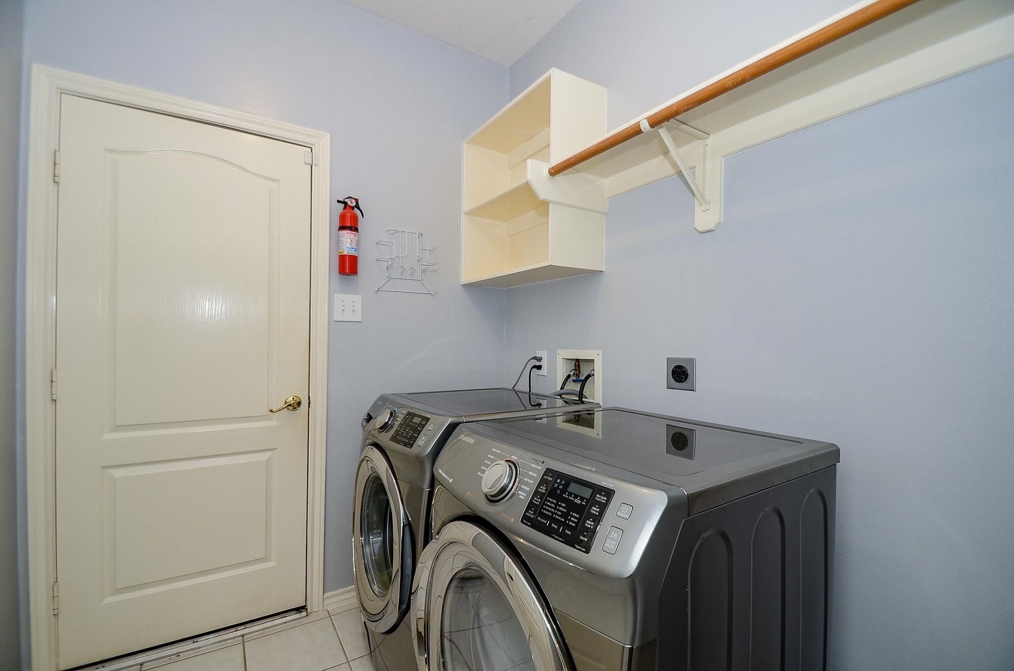 23719 Tustin Ranch Court Katy, TX 77494 - Photo 15 of 31 a utility room with dryer and washer