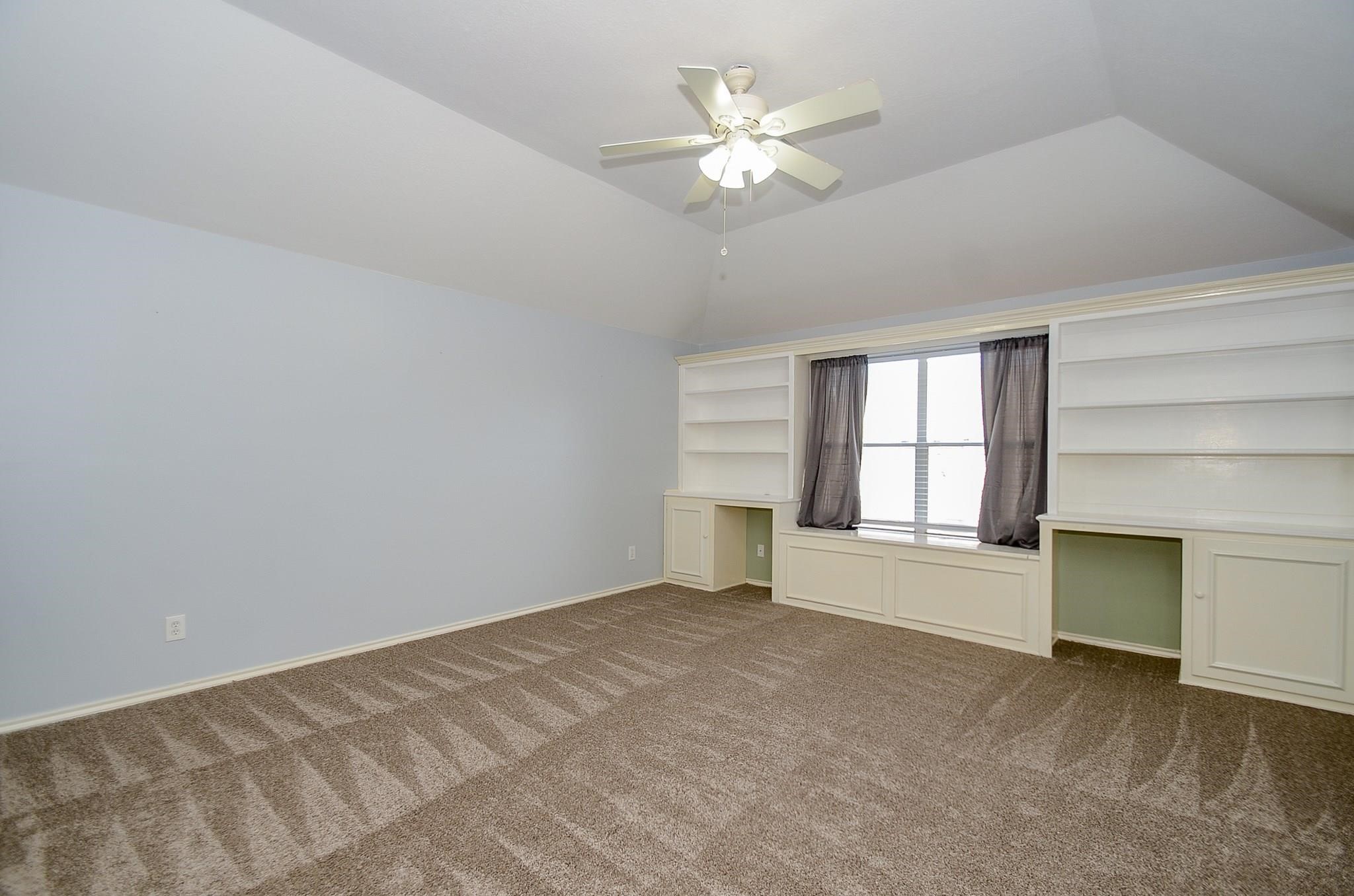 23719 Tustin Ranch Court Katy, TX 77494 - Photo 22 of 31 a view of an empty room with a window