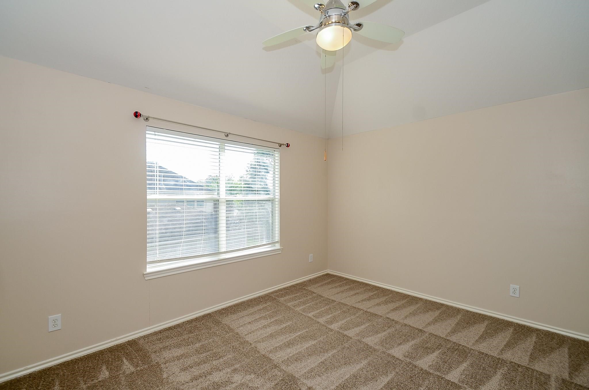 23719 Tustin Ranch Court Katy, TX 77494 - Photo 29 of 31 an empty room with a window