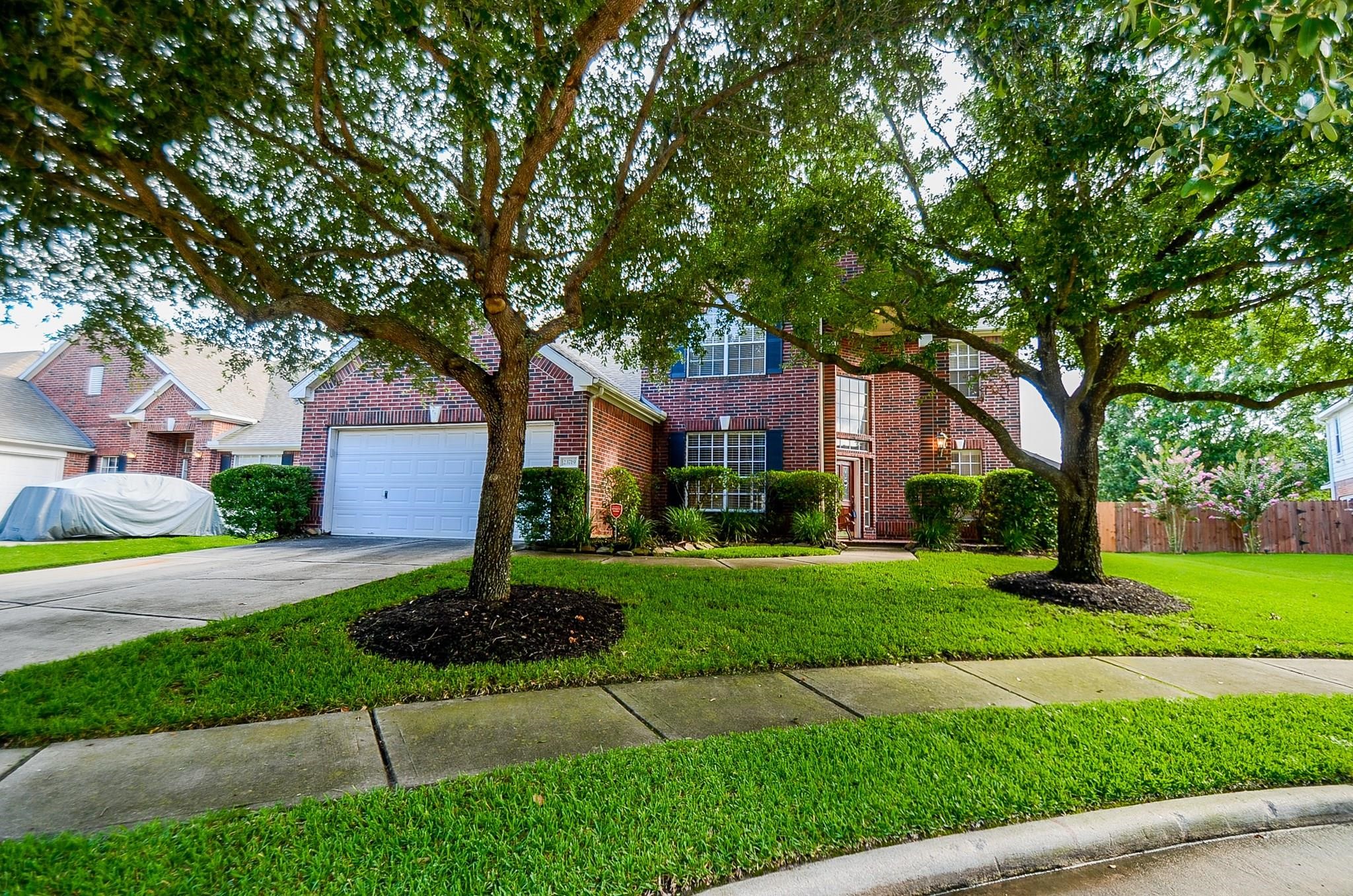 23719 Tustin Ranch Court Katy, TX 77494 - Photo 5 of 31 a front view of a house with a yard