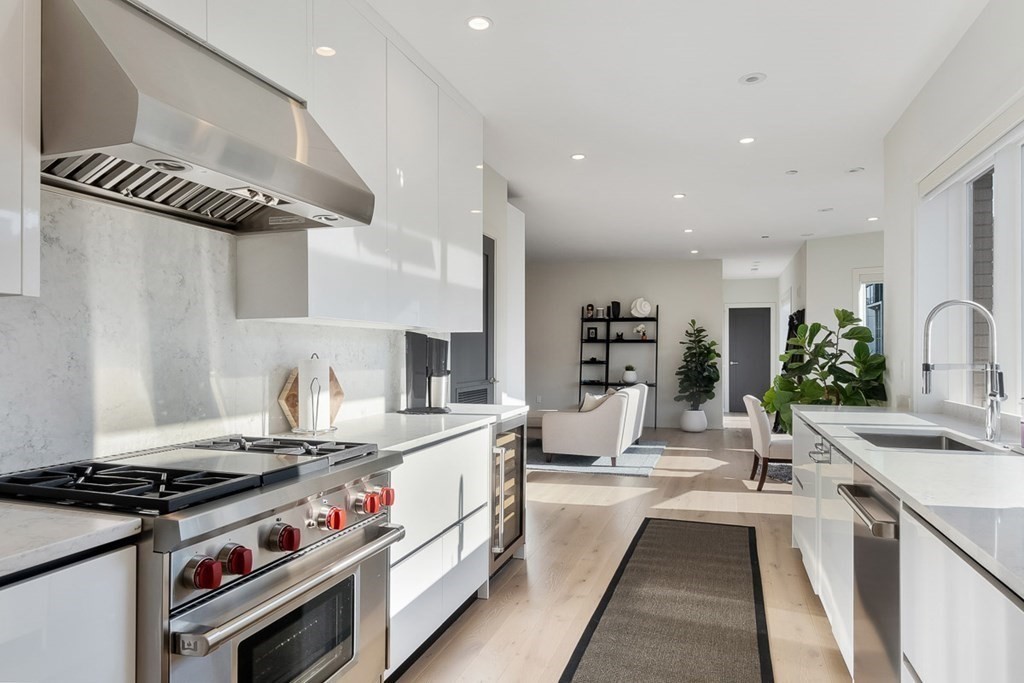 100 A Street, Unit 4 Boston, MA 02127 - Photo 12 of 42 a kitchen with stove and cabinets