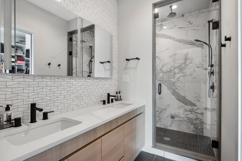 100 A Street, Unit 4 Boston, MA 02127 - Photo 20 of 42 a bathroom with a sink and a mirror