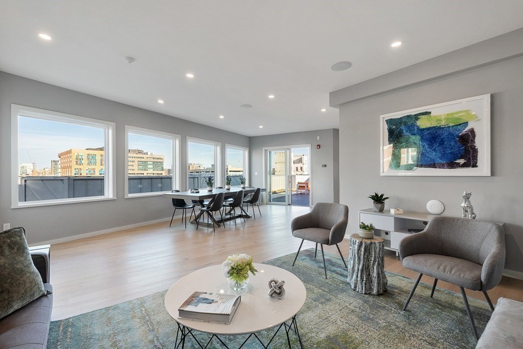 100 A Street, Unit 4 Boston, MA 02127 - Photo 32 of 42 a living room with furniture and window