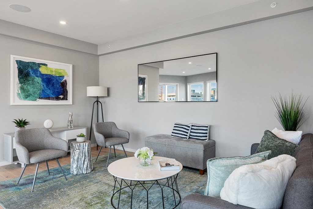 100 A Street, Unit 4 Boston, MA 02127 - Photo 40 of 42 a living room with furniture and a potted plant