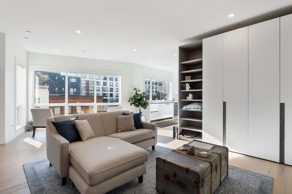 100 A Street, Unit 4 Boston, MA 02127 - Photo 4 of 42 a living room with furniture and a floor to ceiling window