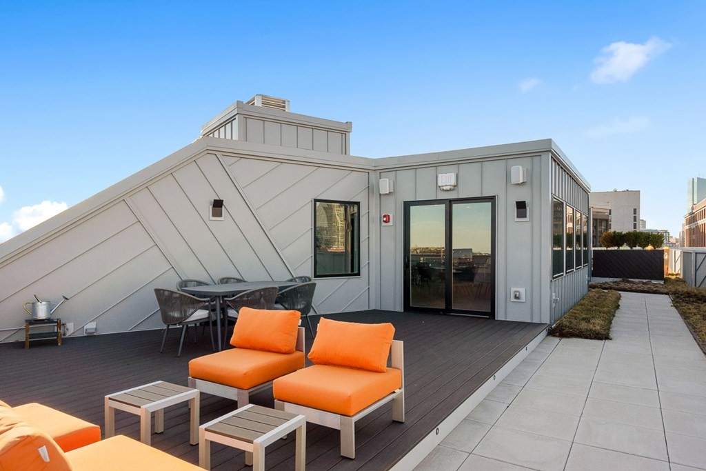 100 A Street, Unit 4 Boston, MA 02127 - Photo 42 of 42 a view of a balcony with furniture and a couch