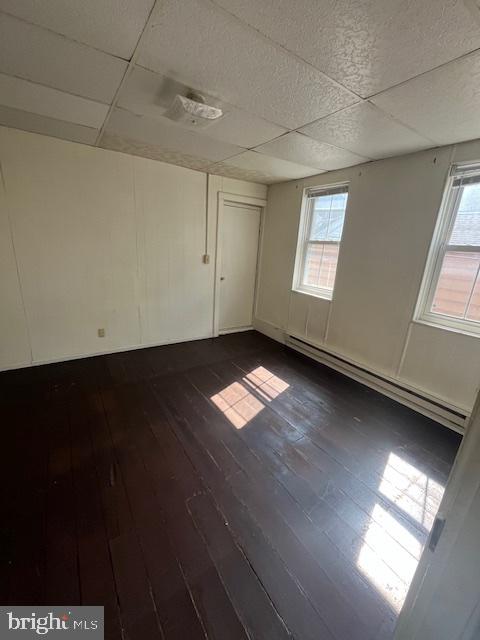 145 East Main Street, Unit 2R Mechanicsburg, PA 17055 - Photo 6 of 10 an empty room with wooden floor and windows