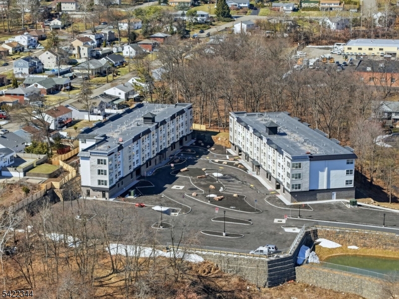 95 Shepherd Lane, Unit B302 Totowa, NJ 07512 - Photo 22 of 24 a view of a house with a yard