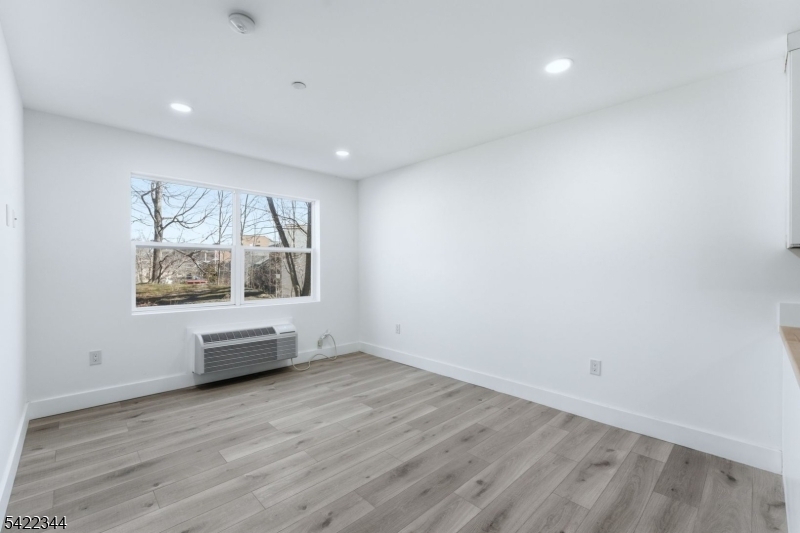 95 Shepherd Lane, Unit B302 Totowa, NJ 07512 - Photo 6 of 24 a view of workspace with wooden floor