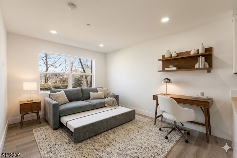 95 Shepherd Lane, Unit B302 Totowa, NJ 07512 - Photo 7 of 24 a living room with furniture and a window