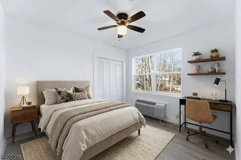 a bedroom with a bed and a desk