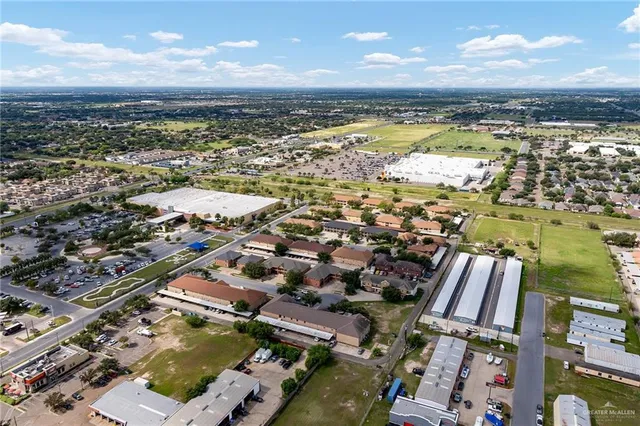 an aerial view of city and lake