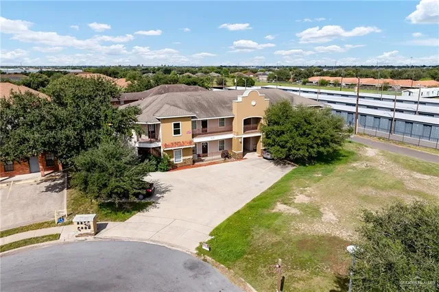 a view of a city with lawn chairs next to a yard