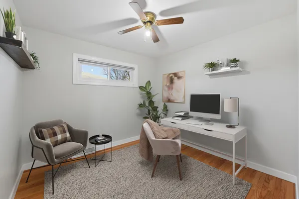 a workspace with furniture and a window