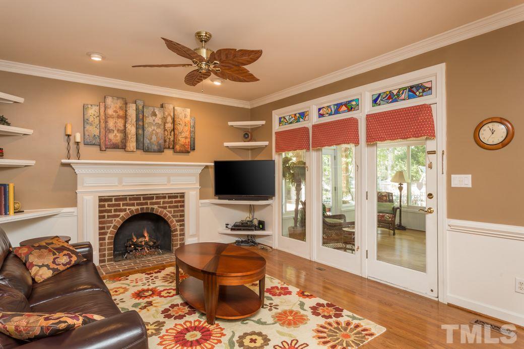 5215 Coffee Tree Drive Raleigh, NC 27613 - Photo 11 of 25 Gorgeous chair railings run around the family room and dining room.