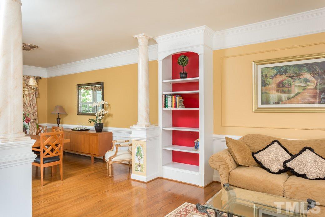 5215 Coffee Tree Drive Raleigh, NC 27613 - Photo 15 of 25 Crown moulding adds luxury to the living room as well as the family room, foyer, kitchen and dining room.