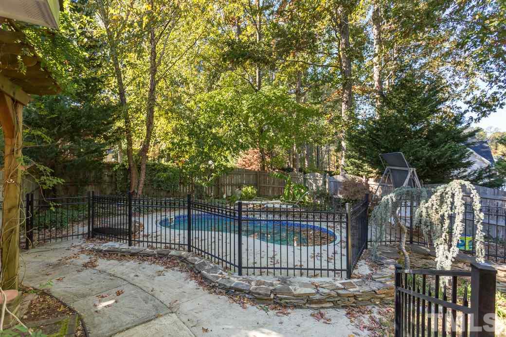 5215 Coffee Tree Drive Raleigh, NC 27613 - Photo 22 of 25 The lounge pool is fenced for safety