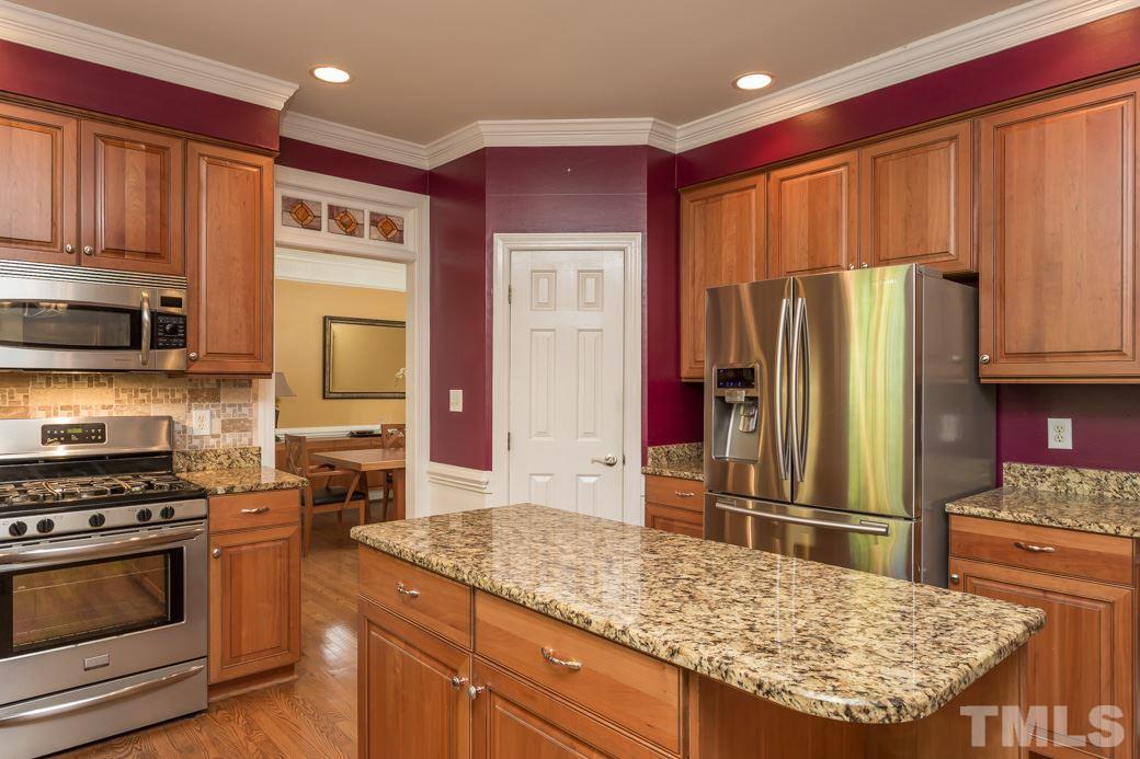 5215 Coffee Tree Drive Raleigh, NC 27613 - Photo 5 of 25 Stainless steel appliances include a convection microwave!