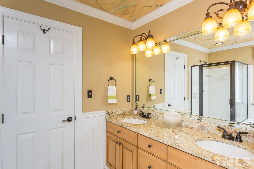 5215 Coffee Tree Drive Raleigh, NC 27613 - Photo 9 of 25 The dual vanity make morning routines a breeze!