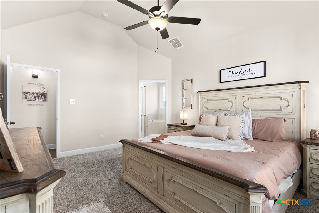 5712 Redfish Court Belton, TX 76513 - Photo 20 of 37 a bedroom with a bed and a chair