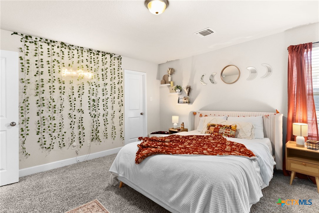 5712 Redfish Court Belton, TX 76513 - Photo 26 of 37 a bedroom with a bed and a window