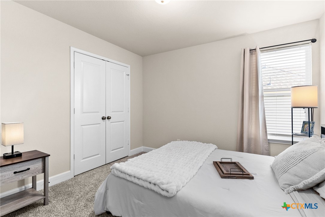 5712 Redfish Court Belton, TX 76513 - Photo 6 of 37 a bedroom with a bed and a window