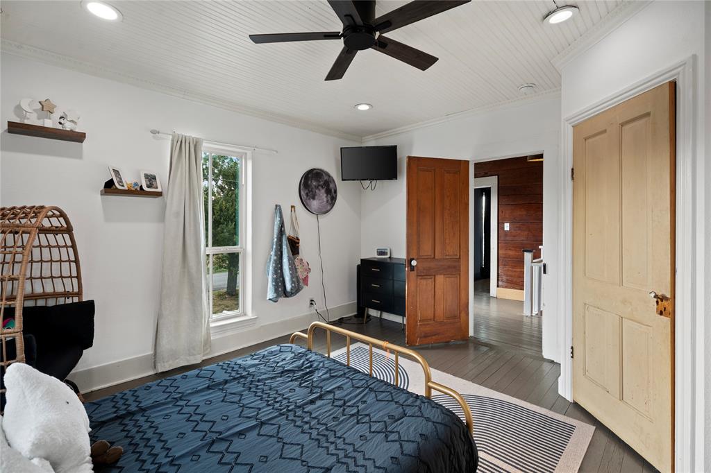 202 North Kickapoo Street Lipan, TX 76462 - Photo 26 of 38 Wood-finish flooring with a ceiling fan, recessed lighting, and white beadboard ceiling